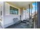 Inviting front porch with seating area, storm door, and well-maintained exterior siding at 145 W Old South St, Bargersville, IN 46106