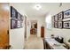 Bright hallway adorned with Gathering photos leading to the dining area at 145 W Old South St, Bargersville, IN 46106