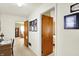 Hallway with warm wood doors leads to a bedroom and living room at 145 W Old South St, Bargersville, IN 46106