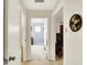 Hallway view with neutral tones and open doorway, showcasing the home's layout and design at 145 W Old South St, Bargersville, IN 46106