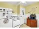 Vintage-style kitchen features a classic refrigerator, stove, and yellow walls at 145 W Old South St, Bargersville, IN 46106