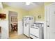 Nostalgic kitchen connects to dining area, featuring classic appliances and bright walls at 145 W Old South St, Bargersville, IN 46106