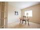 Bedroom featuring desk, chair, window, and simple decor with neutral paint at 1502 Heron Ridge Blvd, Greenwood, IN 46143