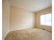 A bright bedroom features neutral walls and carpet with a window overlooking the yard at 1502 Heron Ridge Blvd, Greenwood, IN 46143