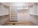 A spacious walk-in closet with ample shelving and clothing racks at 1502 Heron Ridge Blvd, Greenwood, IN 46143