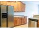 Kitchen featuring stainless steel appliances, light-wood cabinets, and spacious countertops at 1502 Heron Ridge Blvd, Greenwood, IN 46143