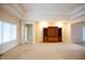 Spacious living room with plush carpet and a built-in entertainment center at 1502 Heron Ridge Blvd, Greenwood, IN 46143
