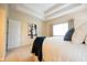 Side view of a main bedroom, showing a white comforter, blue pillows, and ample lighting at 1502 Heron Ridge Blvd, Greenwood, IN 46143