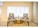 Cozy sitting area with chairs, decorative pillows, and a window with natural light at 1502 Heron Ridge Blvd, Greenwood, IN 46143