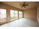 Sunroom offering natural light and views of the yard through multiple windows and glass doors at 1502 Heron Ridge Blvd, Greenwood, IN 46143