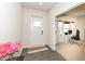 Home entryway with wood-look flooring, a white door, and a view into the adjacent office space at 1506 Moose Ridge Ln, Westfield, IN 46074