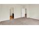 Carpeted bedroom leading to a bathroom and another bedroom at 1627 Clover Crossing Dr, Greenfield, IN 46140