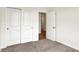 This bedroom has neutral carpet and paint and a large closet for storage space at 1627 Clover Crossing Dr, Greenfield, IN 46140