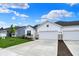 Charming home with a two-car garage, lush lawn, and stone accents, perfect for comfortable living at 1627 Clover Crossing Dr, Greenfield, IN 46140