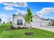 Charming home featuring a two-car garage and inviting curb appeal with stone accents and a well-manicured lawn at 1627 Clover Crossing Dr, Greenfield, IN 46140