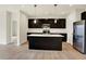 Beautiful kitchen with dark cabinets, stainless steel appliances, a large island, and pendant lighting at 1627 Clover Crossing Dr, Greenfield, IN 46140