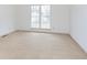 Bright bedroom featuring large windows and plush carpeting at 2619 Chaseway Ct, Indianapolis, IN 46268