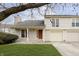 Inviting two-story home with attached garage, well-kept lawn, and appealing landscaping at 2619 Chaseway Ct, Indianapolis, IN 46268