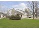 A well-maintained, inviting two-story home with lush lawn and attached two-car garage at 2619 Chaseway Ct, Indianapolis, IN 46268