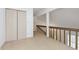Second-floor hallway with folding closet doors, neutral carpet, and natural light at 2619 Chaseway Ct, Indianapolis, IN 46268