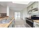 Bright kitchen with stainless steel appliances and a view to the backyard at 2619 Chaseway Ct, Indianapolis, IN 46268