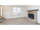 Bright living room featuring a stone fireplace and plush carpeting at 2619 Chaseway Ct, Indianapolis, IN 46268