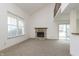 Bright living room with stone fireplace, large window and sliding glass door with vaulted ceilings at 2619 Chaseway Ct, Indianapolis, IN 46268