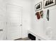 Welcoming entryway with white wainscoting, bench, coat hooks, and stylish decor at 2735 Linwood Ave, Greenwood, IN 46143
