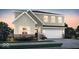 Charming two-story home with a manicured lawn, attached garage and beautiful architectural details at 2735 Linwood Ave, Greenwood, IN 46143