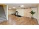 Finished basement with wood floors, barn door, and plenty of space for a home gym or recreational area at 2838 Violet W Ct, Columbus, IN 47201