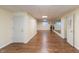 Spacious basement featuring wood-look floors, a mirrored wall, and multiple doors at 2838 Violet W Ct, Columbus, IN 47201