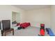 Finished basement with gym equipment, mirrored wall, and neutral carpet at 2838 Violet W Ct, Columbus, IN 47201