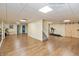 Basement area with wood-look flooring, mirrored wall, and workout equipment at 2838 Violet W Ct, Columbus, IN 47201