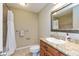 Bathroom showcasing a vanity with a granite countertop, sink, and shower featuring a shower curtain at 2838 Violet W Ct, Columbus, IN 47201