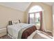 Cozy bedroom with a large window that provides natural light and exterior views at 2838 Violet W Ct, Columbus, IN 47201
