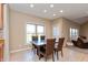 Cozy dining area adjacent to the kitchen, featuring tile floors and ample natural light at 2838 Violet W Ct, Columbus, IN 47201