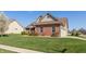 Charming brick and siding two-story home with well-maintained lawn and attached two car garage at 2838 Violet W Ct, Columbus, IN 47201