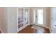 Welcoming foyer with hardwood floors, decorative glass front door, and adjacent french doors at 2838 Violet W Ct, Columbus, IN 47201