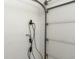 Interior garage wall featuring EV charging station with an open garage door at 2838 Violet W Ct, Columbus, IN 47201