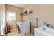 Functional laundry room featuring a washer and dryer, a sink, and ample storage space at 2838 Violet W Ct, Columbus, IN 47201