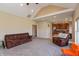 Inviting living room with vaulted ceilings, neutral carpet, and an open layout to the kitchen at 2838 Violet W Ct, Columbus, IN 47201