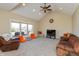 Bright living room featuring vaulted ceilings, plush carpeting, and large windows with deck views at 2838 Violet W Ct, Columbus, IN 47201