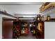 Entertainers bar featuring dark cabinetry, wine rack, and beverage display at 2951 E 62Nd St, Indianapolis, IN 46220