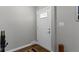 Clean foyer featuring fresh paint, hardwood floors, updated light switches, and a white door at 2951 E 62Nd St, Indianapolis, IN 46220