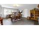 Comfortable living room with neutral walls, tile floors, furniture, bright window, and natural light at 2951 E 62Nd St, Indianapolis, IN 46220
