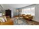 Open living room with stylish furniture, hardwood floors, and a bright window at 2951 E 62Nd St, Indianapolis, IN 46220