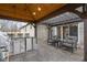 Inviting outdoor kitchen with a built-in grill, bar seating, and a covered pergola, perfect for entertaining guests at 2951 E 62Nd St, Indianapolis, IN 46220