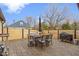 Beautiful backyard patio with a dining set, modern grill, and privacy fence, perfect for outdoor gatherings at 2951 E 62Nd St, Indianapolis, IN 46220