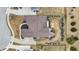 An aerial view highlights a detailed roof, a patio with a fire pit, and the landscaping of a single Gathering house at 3924 Bear Creek Way, Carmel, IN 46074