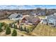 This backyard features a covered patio and a charming fire pit area, perfect for outdoor entertaining and relaxation at 3924 Bear Creek Way, Carmel, IN 46074